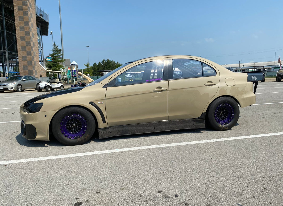 Beige Mitsubishi Evo X drag car at the track