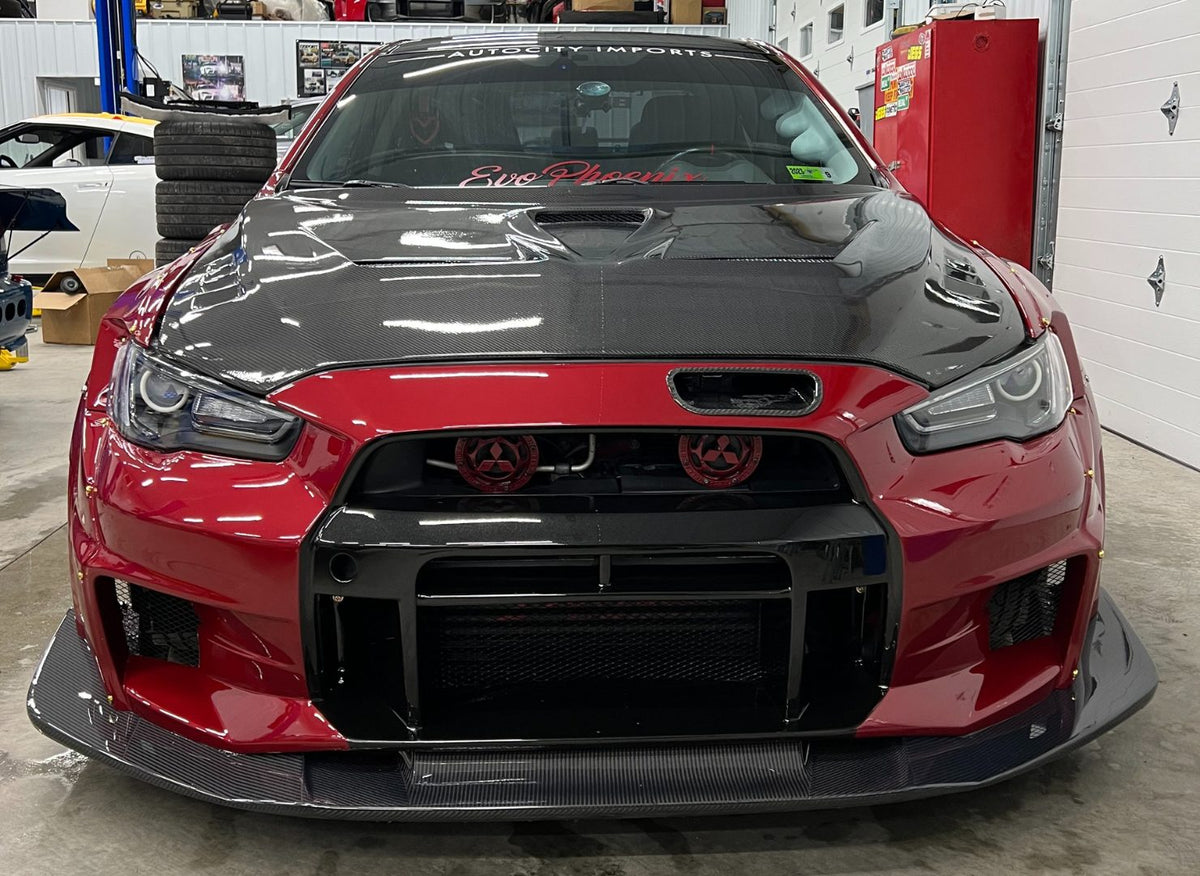 Front view of Cora's red Varis widebody Evo X