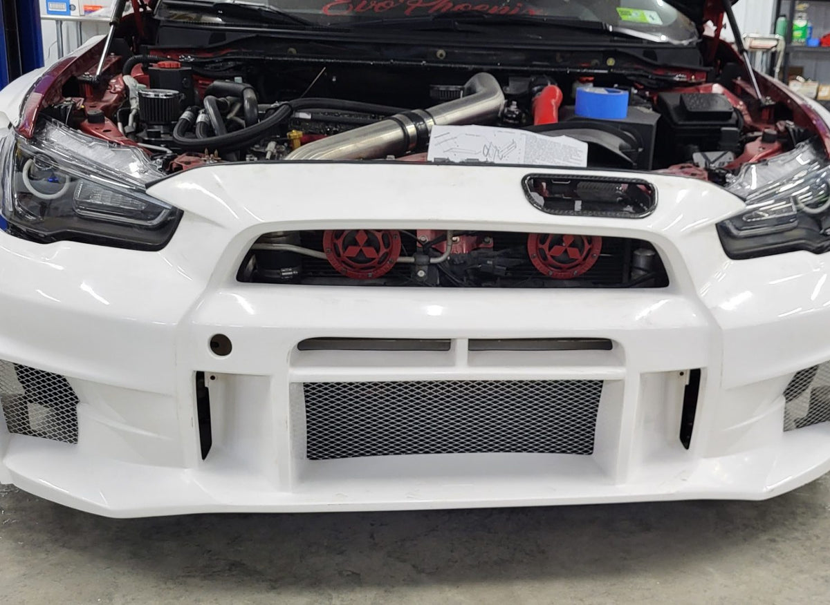 Engine bay and front intercooler during the Evo X widebody test fit