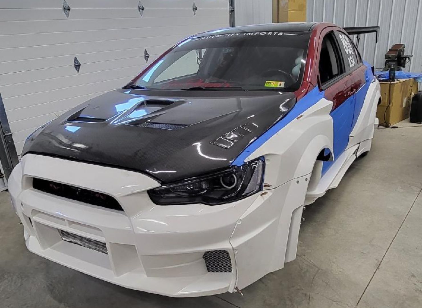 Front view of the Evo X with mixed panels during bodywork