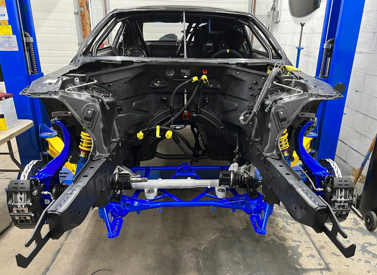 Stripped R35 GTR front chassis with its blue subframe