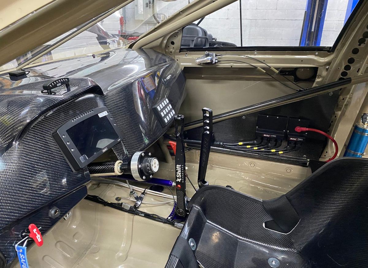 Evo X race-car interior with carbon dash and wiring