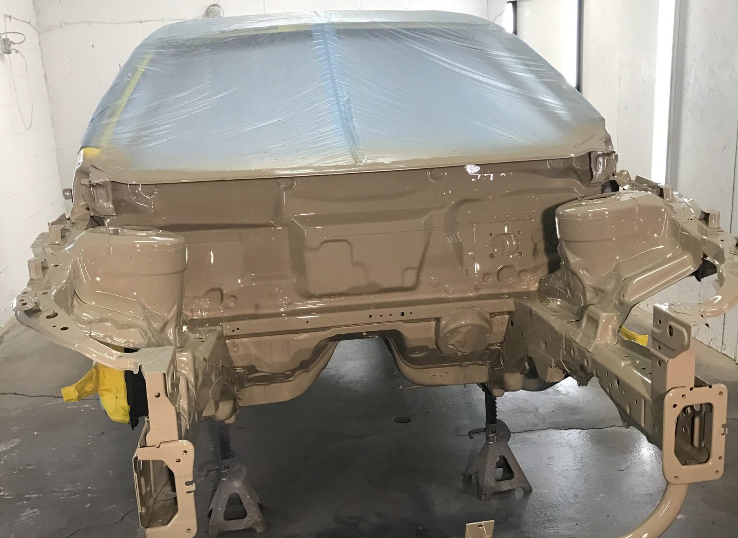 Bare Evo X chassis masked and prepared for paint
