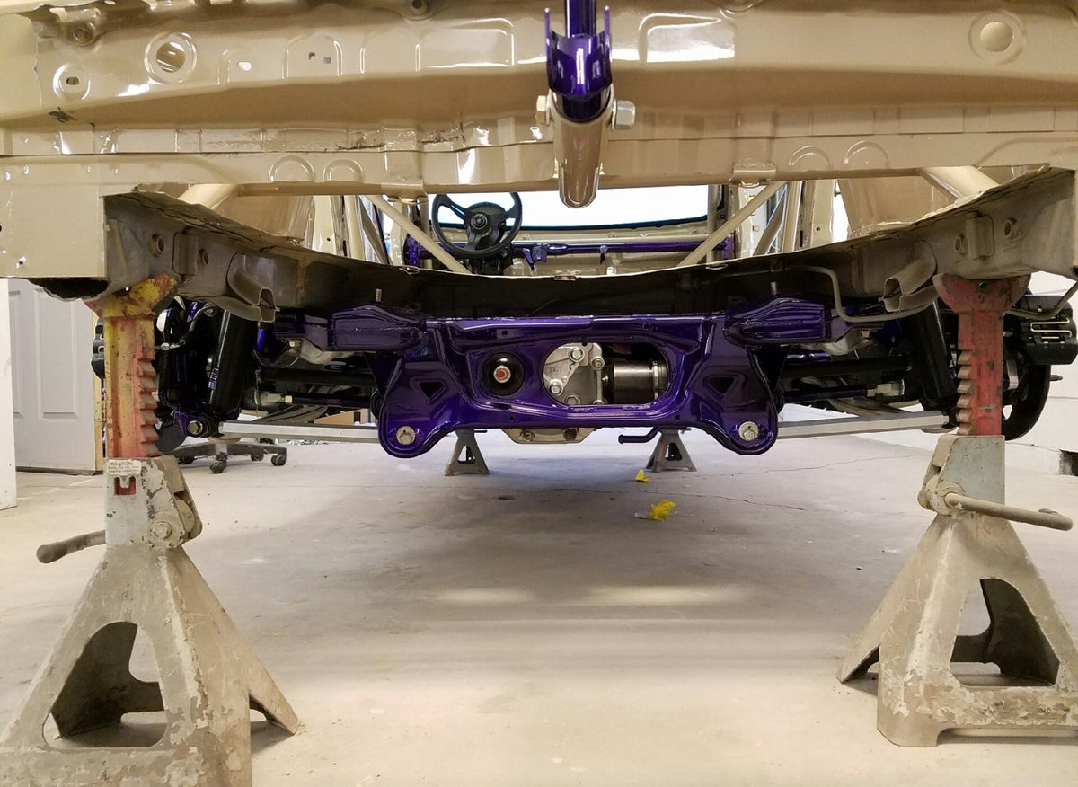 Evo X rear suspension with a purple subframe