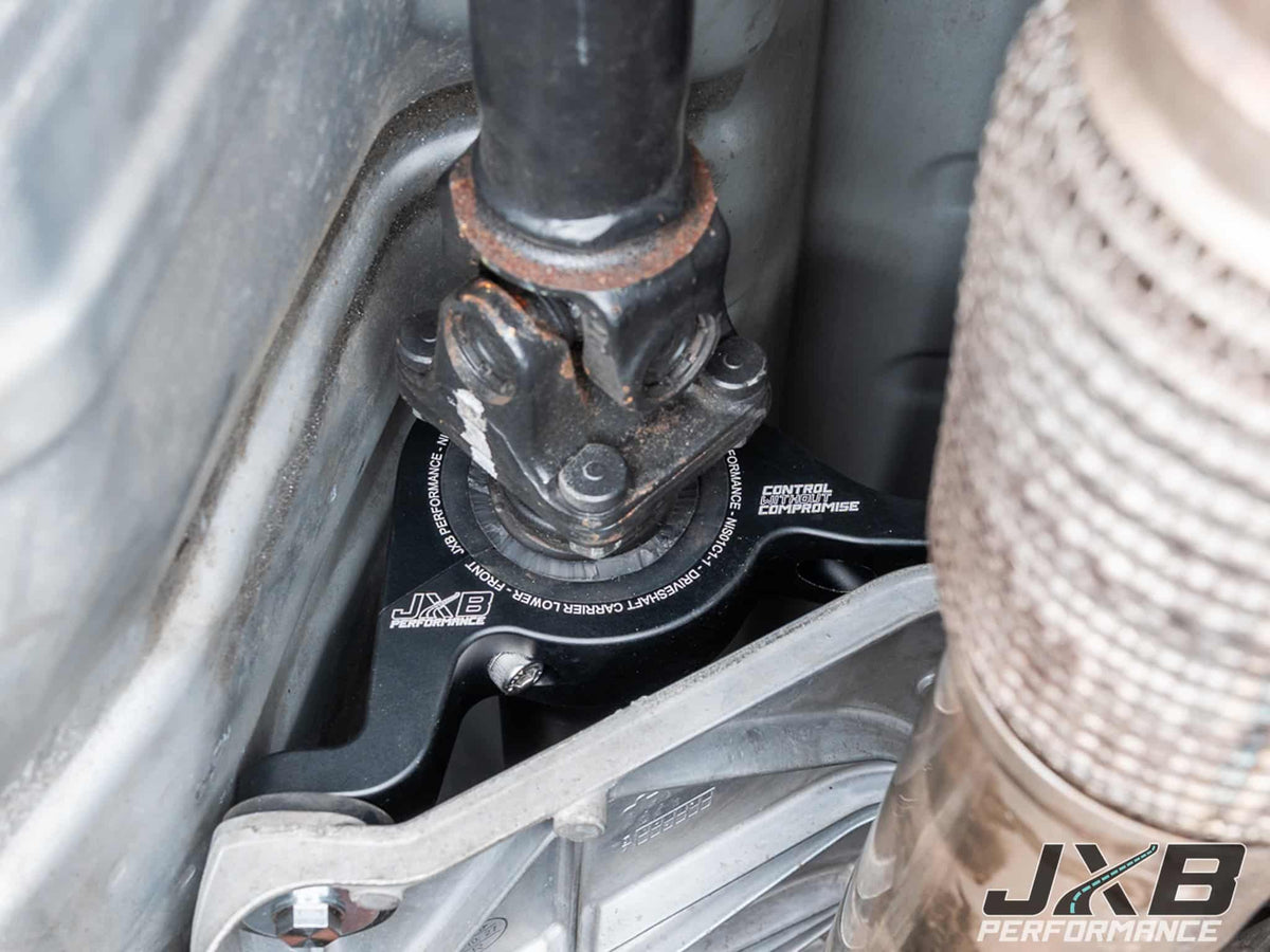 Upgraded driveshaft center support bearing carrier installed