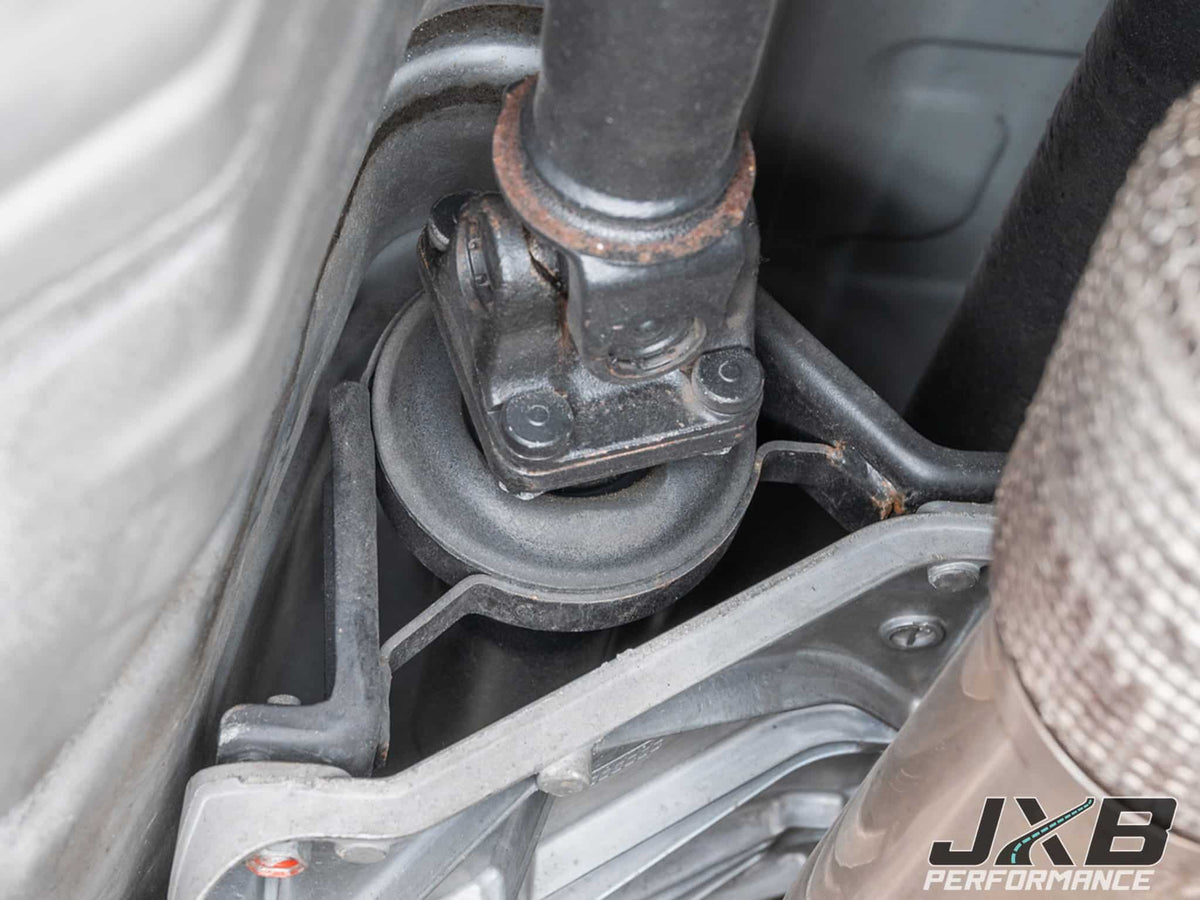 Worn OEM driveshaft center support bushing
