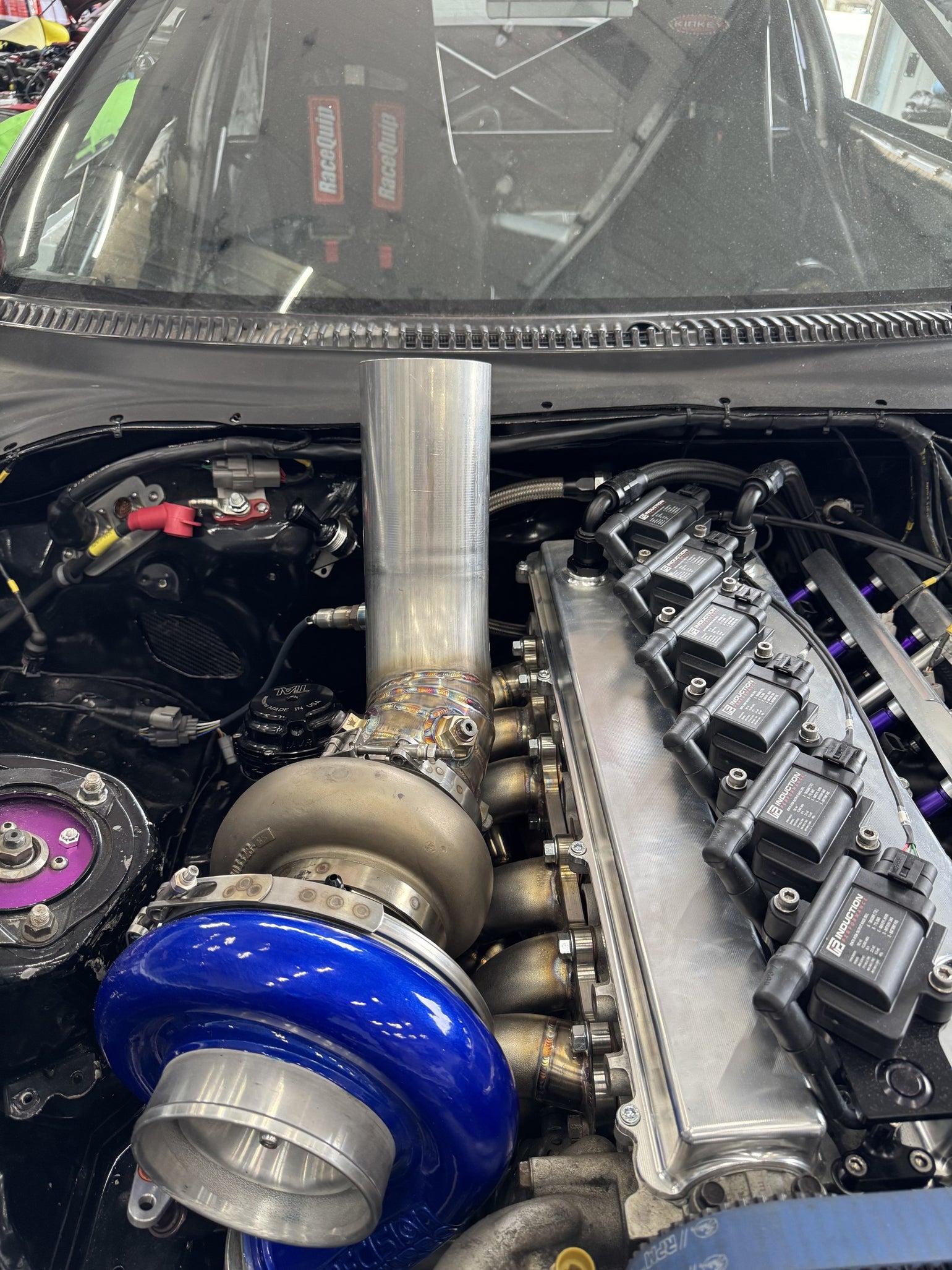 Custom turbo and hood-exit exhaust fabrication on an MK4 Supra