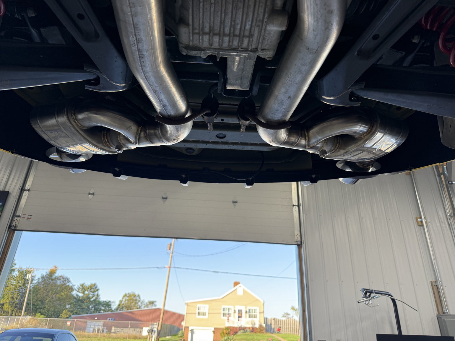 Custom Valvetronic exhaust installed beneath a Camaro SS