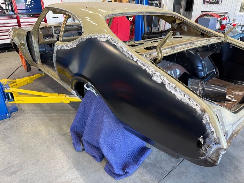 Fabricated Cutlass quarter panel after metal finishing and coating