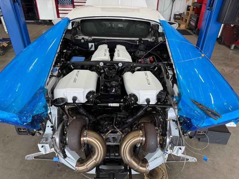 Twin-turbo system fabrication at the rear of a Lamborghini