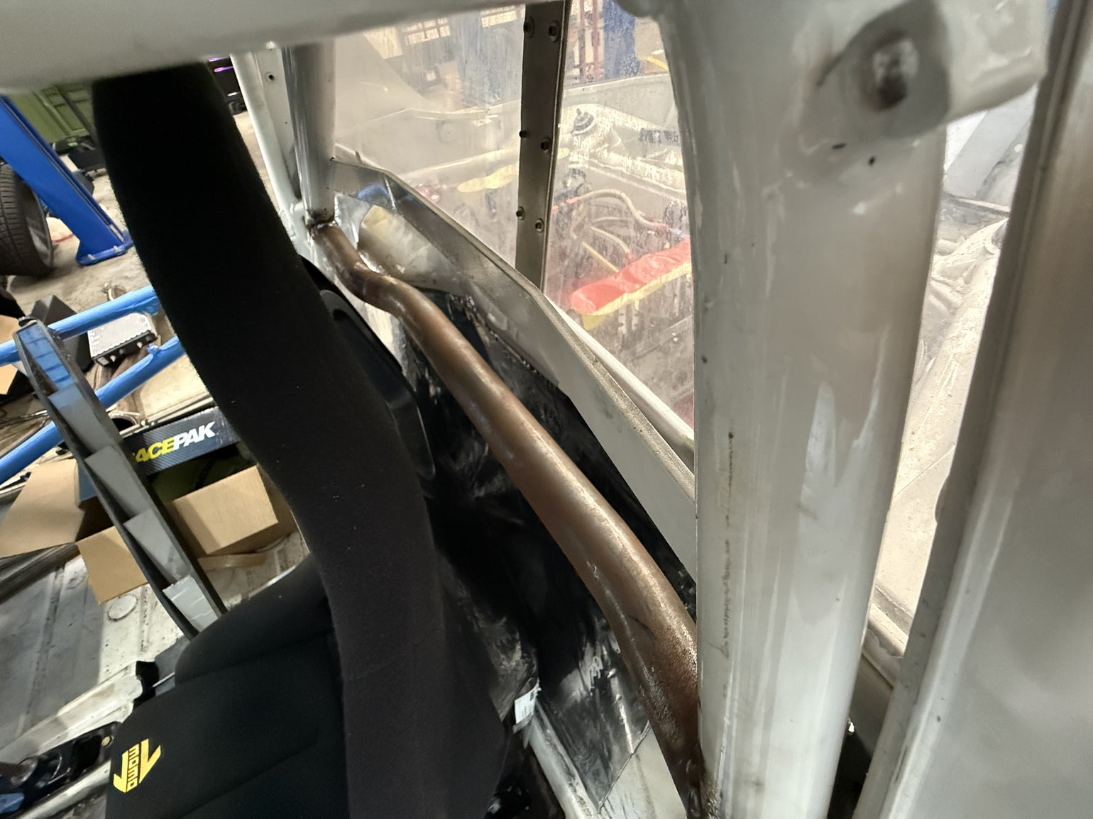 Custom roll-cage and driver-area fabrication in a Porsche 914 track car
