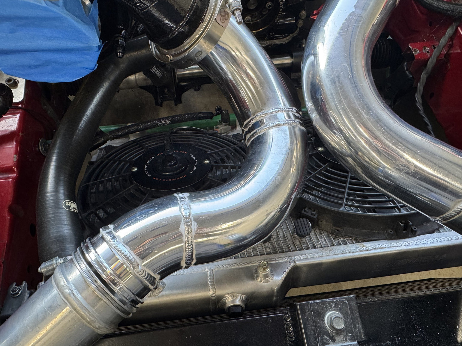Polished aluminum turbo piping fabricated for an RX-7