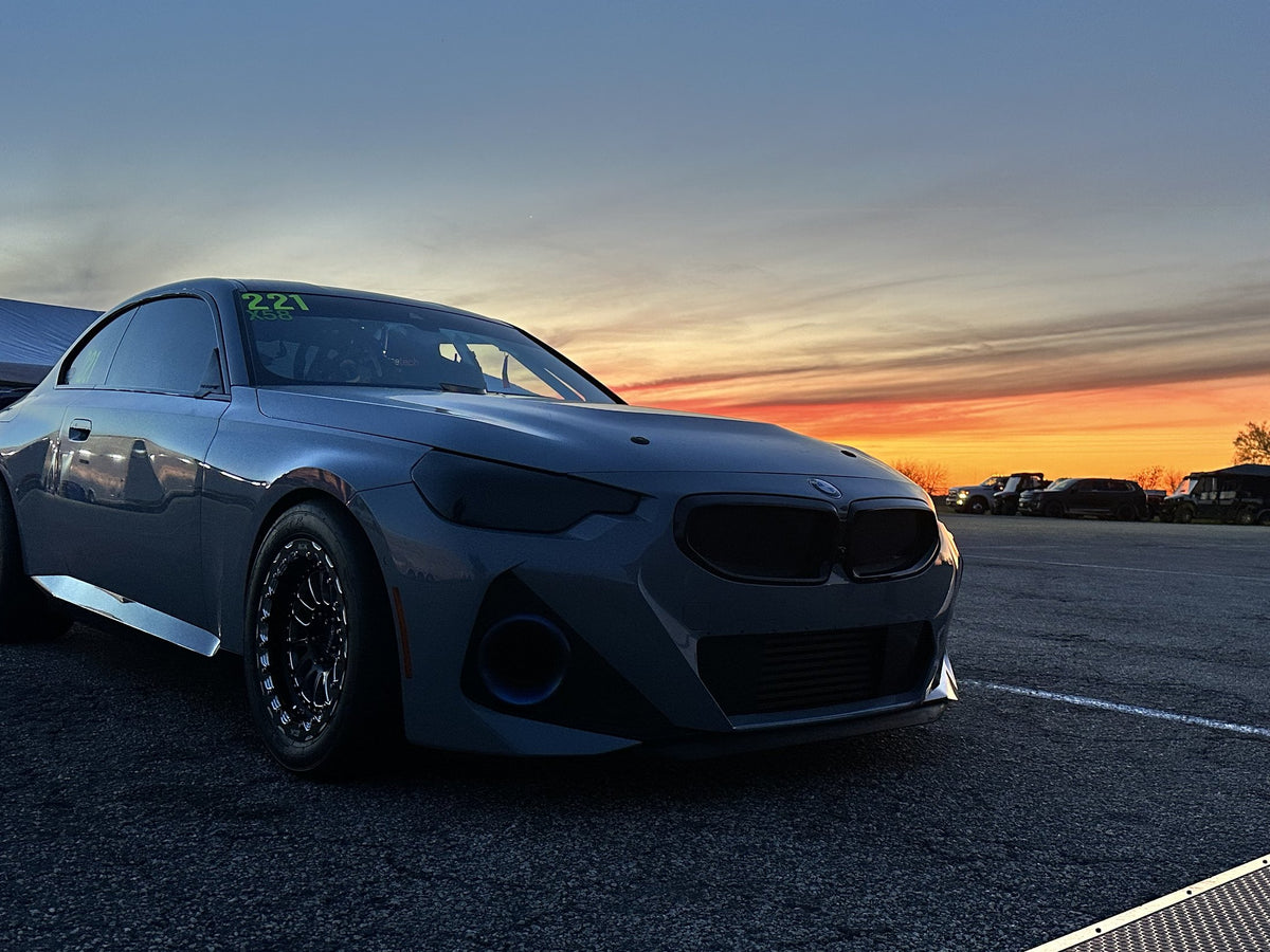 Side profile of the Grade A Garage BMW M240 at sunset